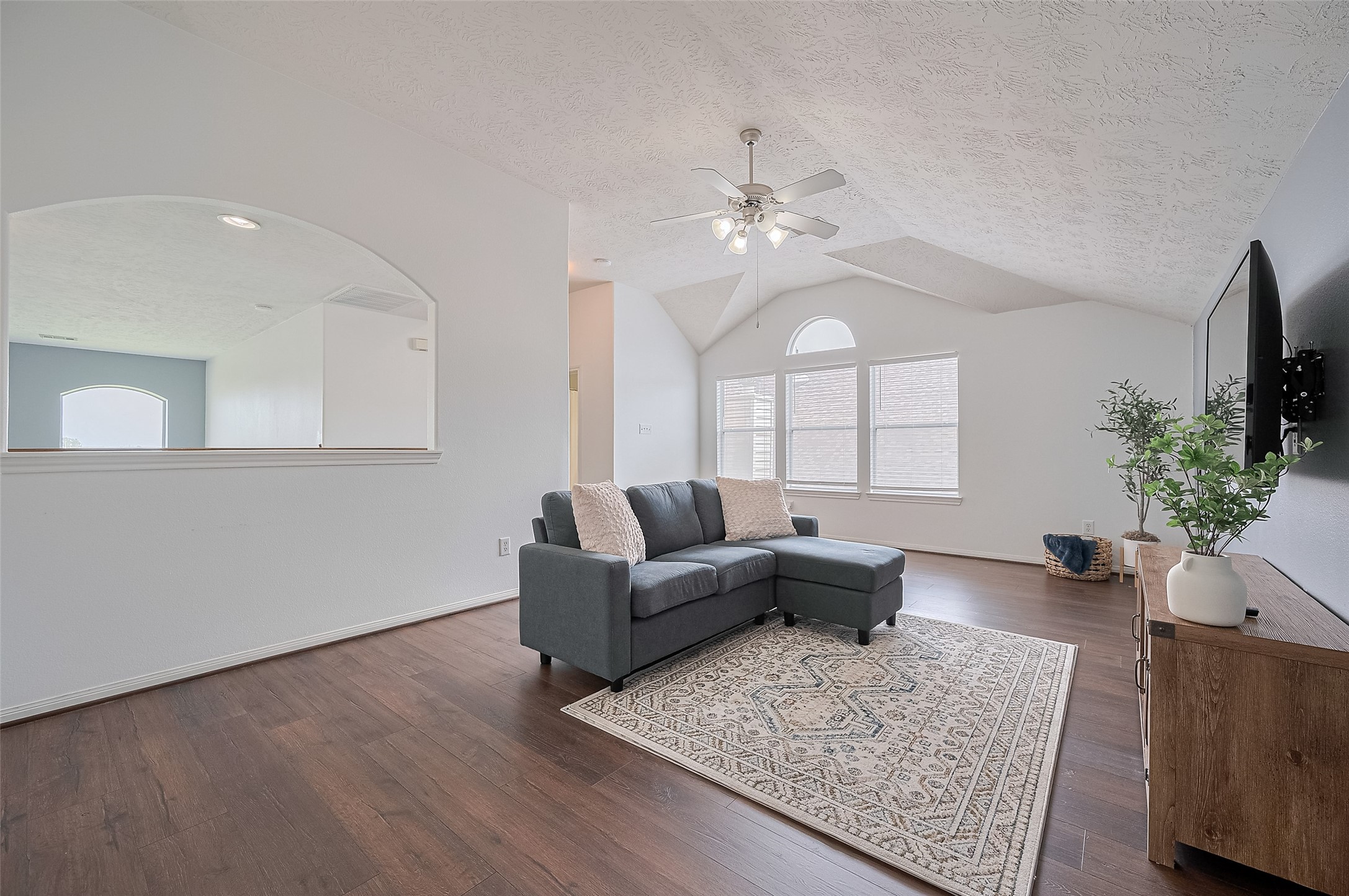 21506 Avalon Queen Drive Spring, TX 77379 - Photo 32 of 48 a living room with furniture and a chandelier