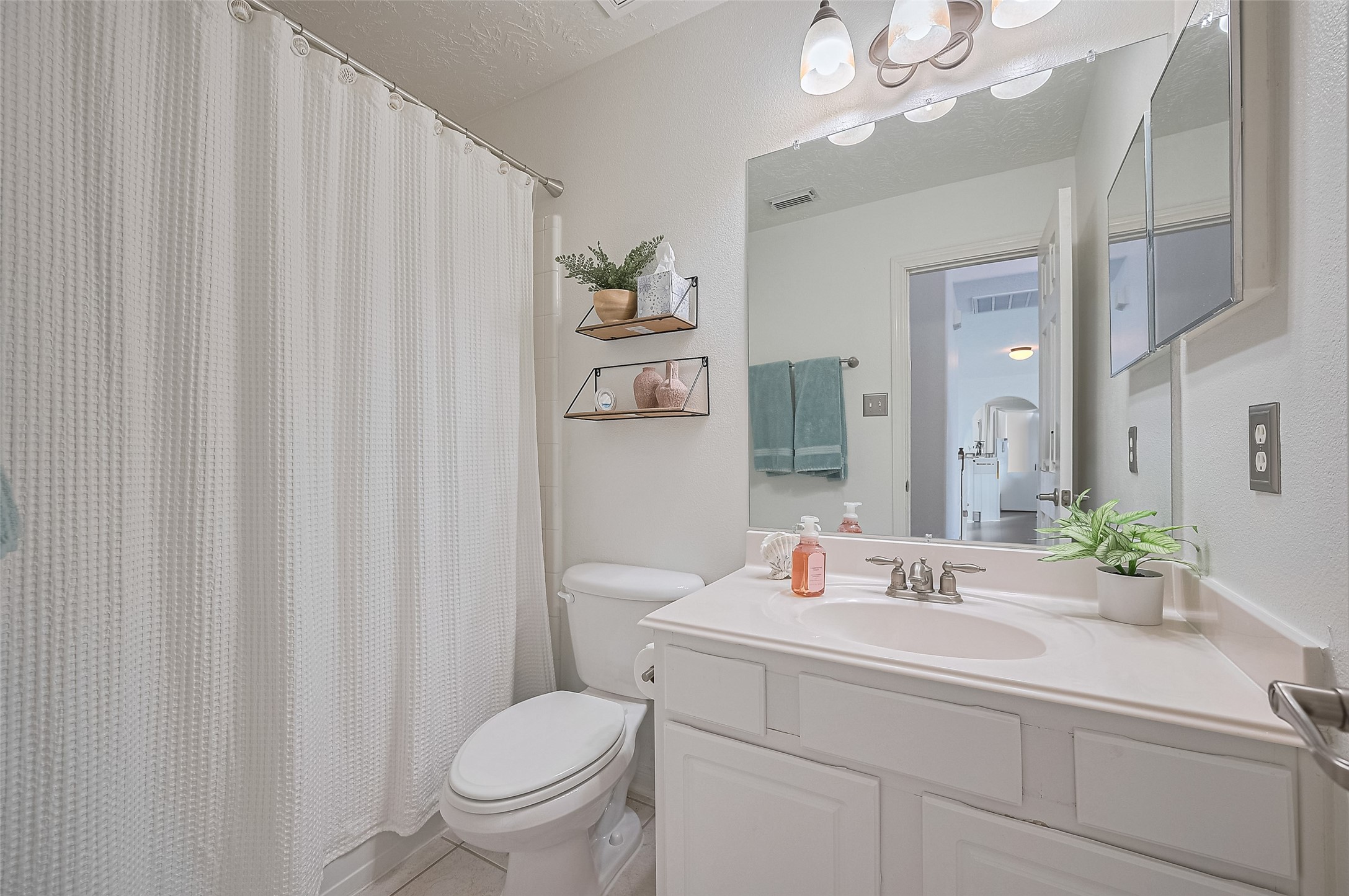 21506 Avalon Queen Drive Spring, TX 77379 - Photo 35 of 48 a bathroom with a sink a toilet and a mirror