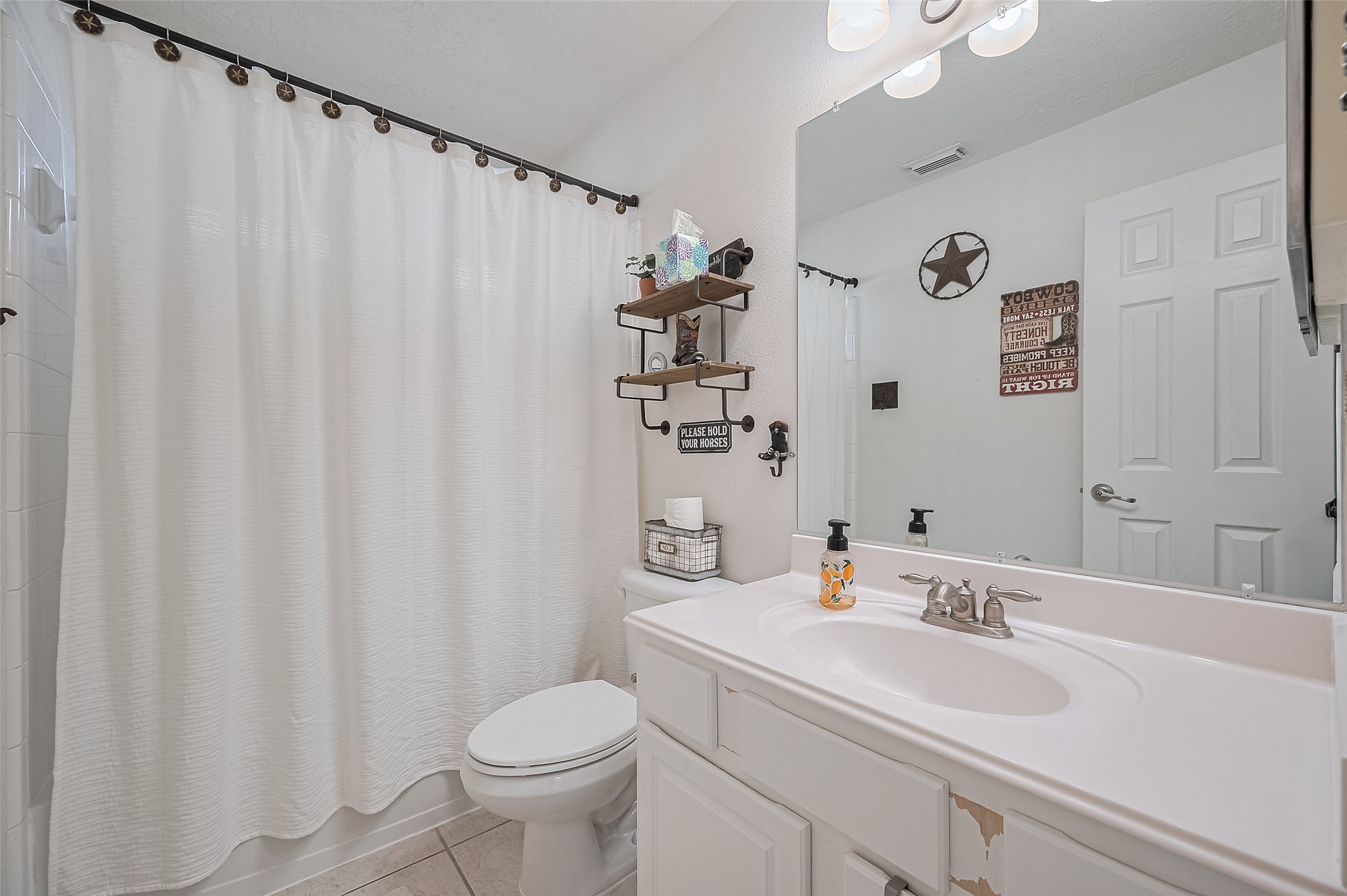 21506 Avalon Queen Drive Spring, TX 77379 - Photo 36 of 48 This full bathroom features a classic combination of a shower and bathtub, perfect for everyday convenience or relaxing soaks.