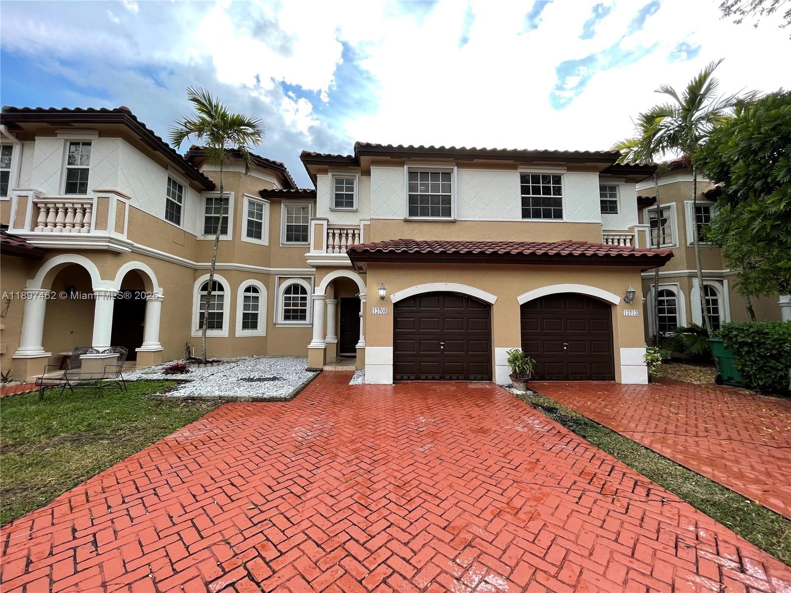 12708 Southwest 49th Drive, Unit 12708 Miramar, FL 33027 - Photo 1 of 14 a view of a house with a yard