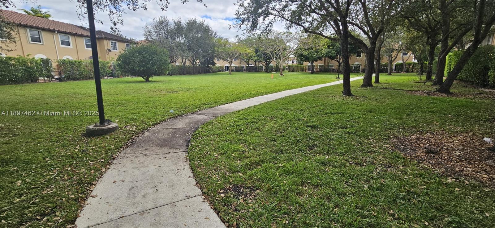 12708 Southwest 49th Drive, Unit 12708 Miramar, FL 33027 - Photo 5 of 14 a view of a park with large trees