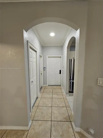 a view of a hallway with a bathroom