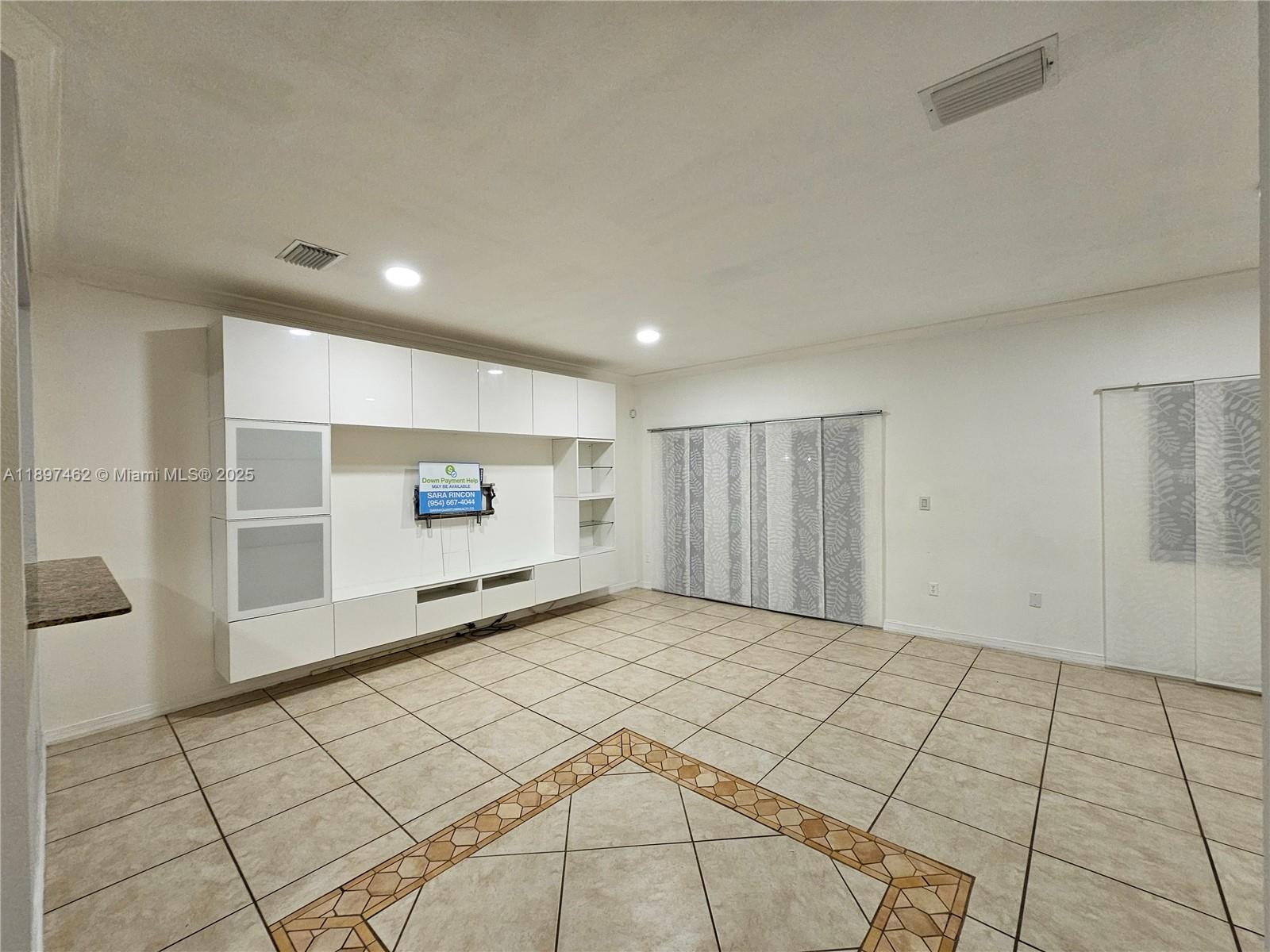 12708 Southwest 49th Drive, Unit 12708 Miramar, FL 33027 - Photo 9 of 14 a view of an empty room and window