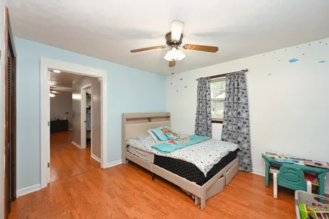 a bedroom with furniture and window