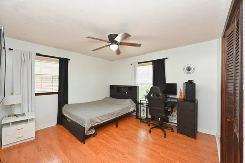 a bedroom with workspace