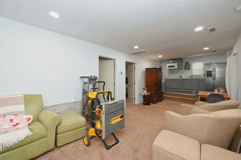 a work room with furniture and white walls