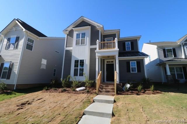 5165 Waterloo Drive, Unit CC153 Tega Cay, SC 29708 - Photo 1 of 6 a front view of a house with yard