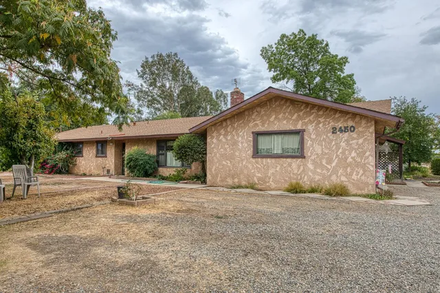 a house with trees in the background