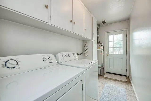 a bedroom with a bed next to a window