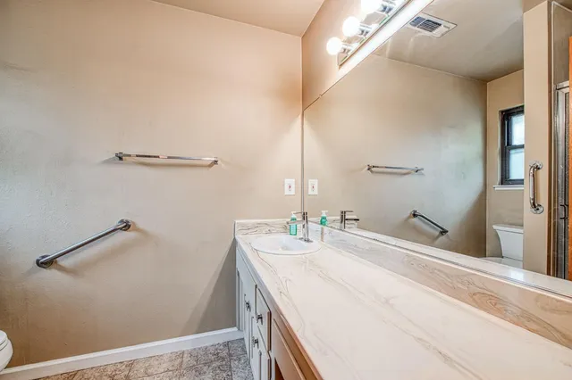 a view of a chairs and table in backyard