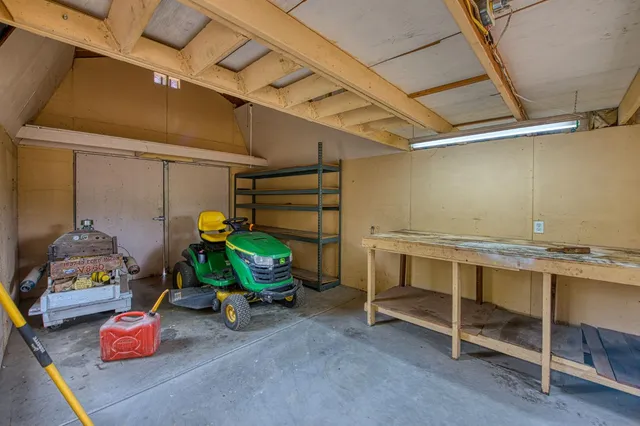 a view of an empty room with wooden roof