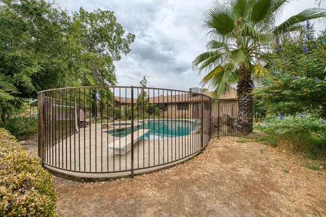 a view of a lake with a house in the background