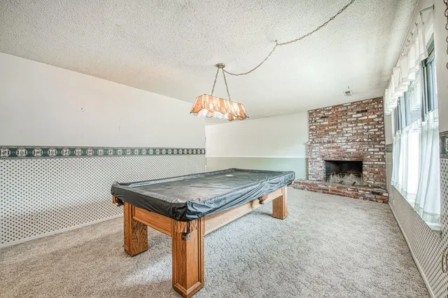 a room with table and chairs