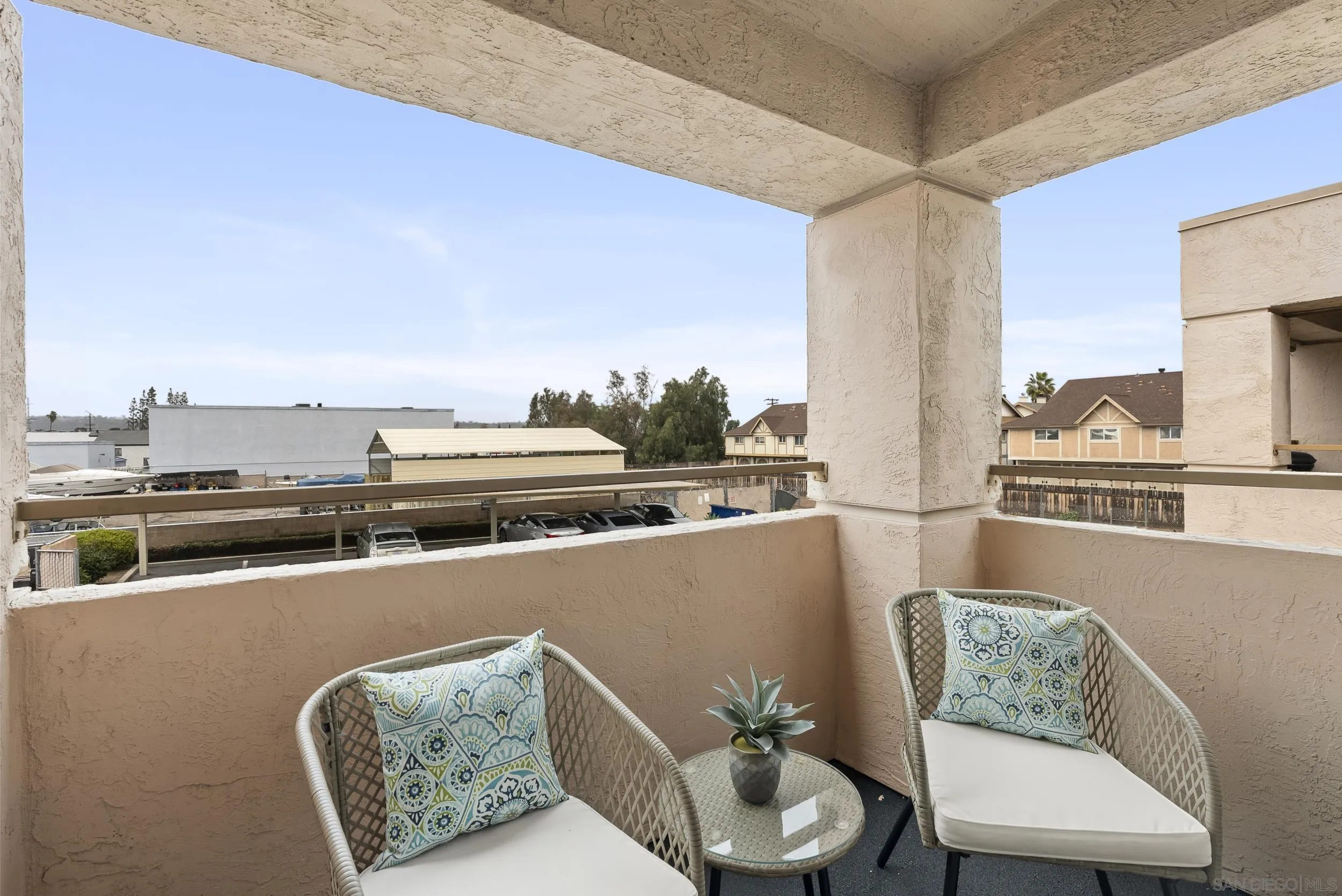830 Broadway, Unit 15 El Cajon, CA 92021 - Photo 17 of 21 a living room with furniture and a floor to ceiling window