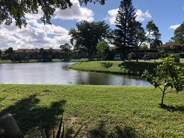 a view of a lake with a yard