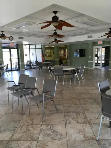 a dining room with furniture a chandelier
