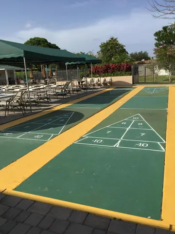 a view of a swimming pool with outdoor seating