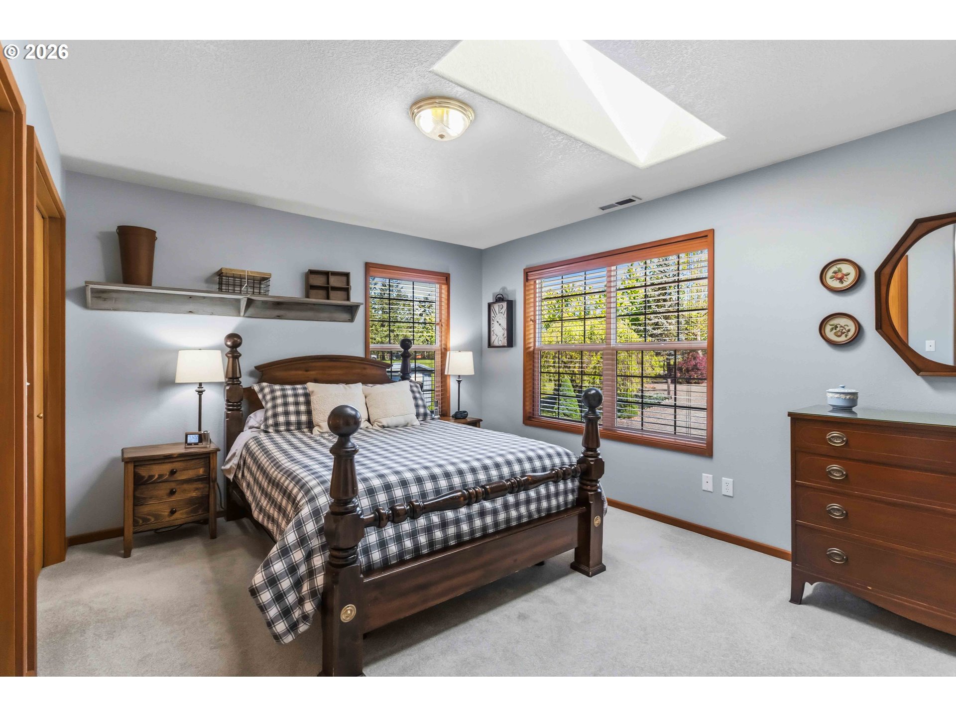 359 Frank Smith Road Toutle, WA 98649 - Photo 22 of 44 a bedroom with a bed and a dresser next to a window