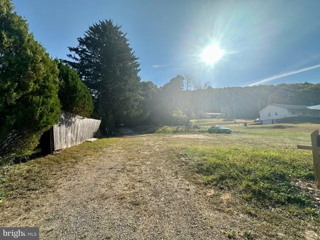 a view of a yard with an ocean