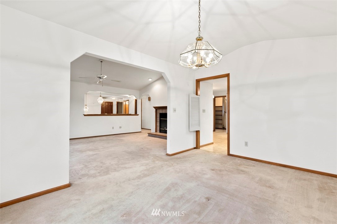 242 Middlefield Road Bellingham, WA 98225 - Photo 11 of 31 wooden floor in an empty room with a window