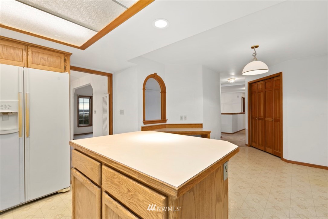 242 Middlefield Road Bellingham, WA 98225 - Photo 16 of 31 a room with a bed and a chandelier