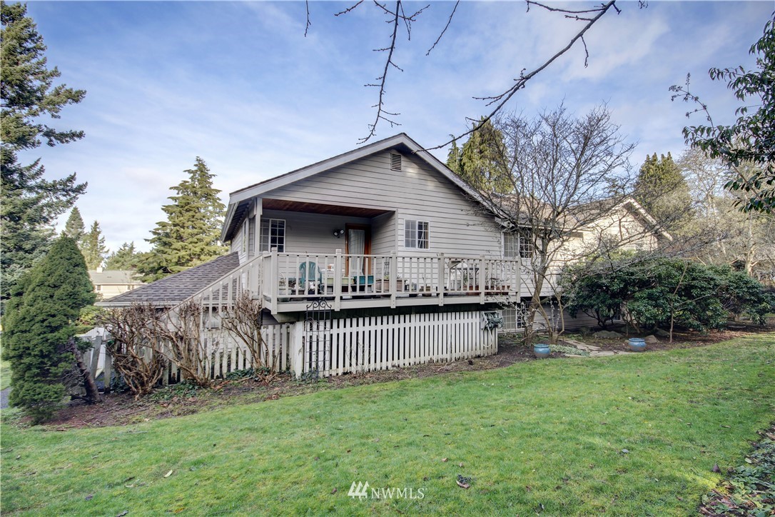 242 Middlefield Road Bellingham, WA 98225 - Photo 29 of 31 a backyard of a house with bicycles parked and swing