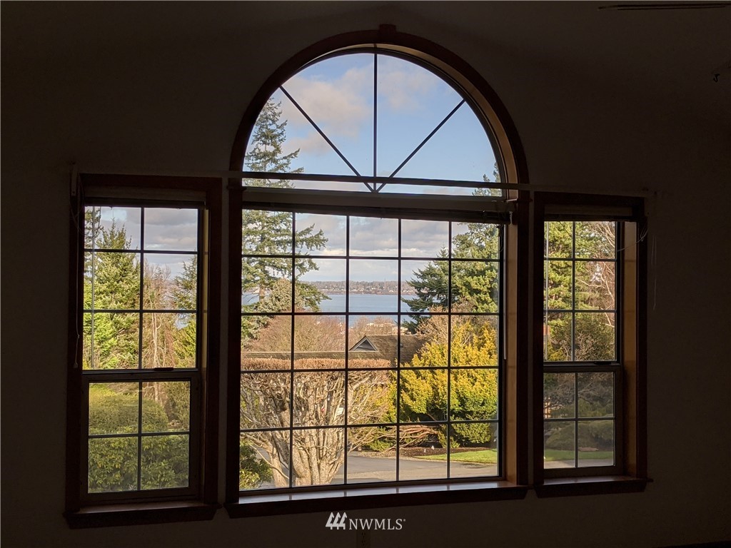 242 Middlefield Road Bellingham, WA 98225 - Photo 5 of 31 a view of a big room with a large window and wooden floor