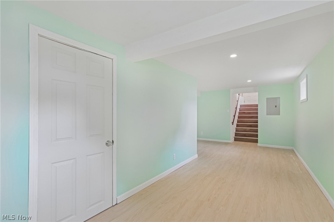 4188 Manchester Road Perry, OH 44081 - Photo 33 of 41 Light wood-finish flooring with recessed lighting and a paneled interior door