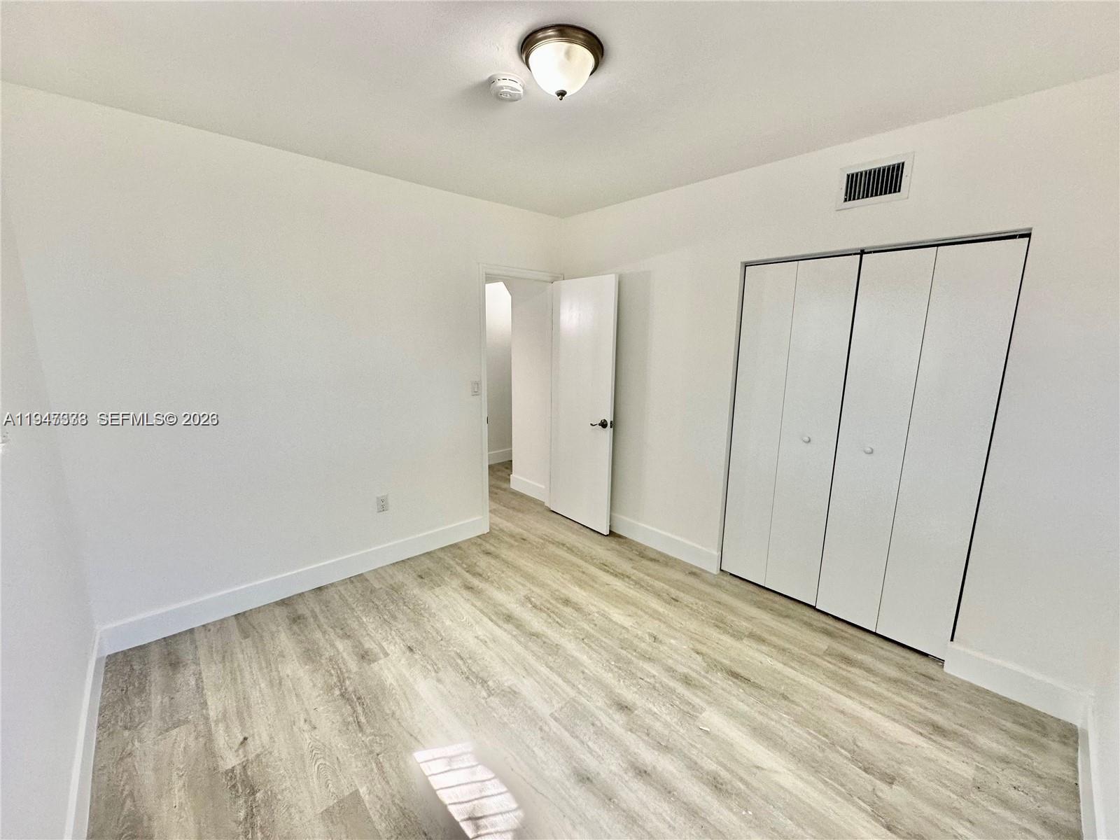 1894 Northwest 53rd Street Miami, FL 33142 - Photo 11 of 19 a view of an empty room