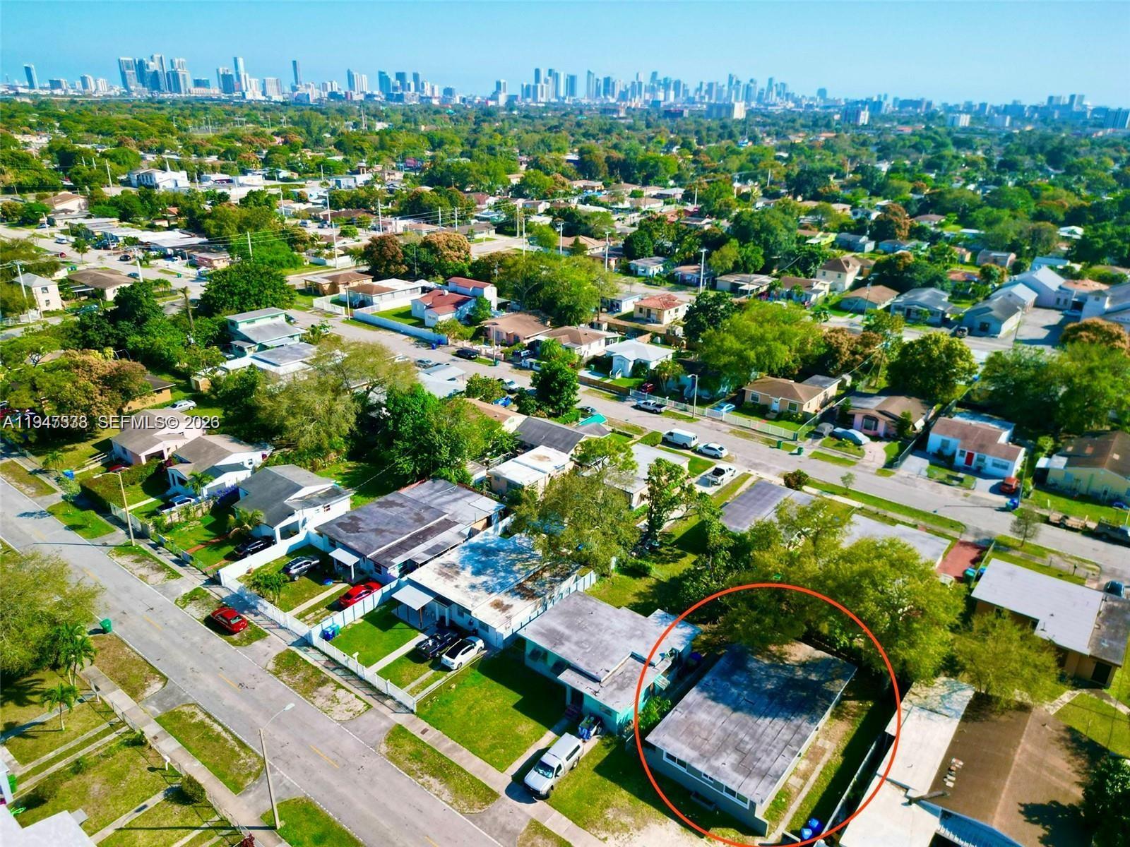 1894 Northwest 53rd Street Miami, FL 33142 - Photo 16 of 19 an aerial view of residential houses with outdoor space and street view