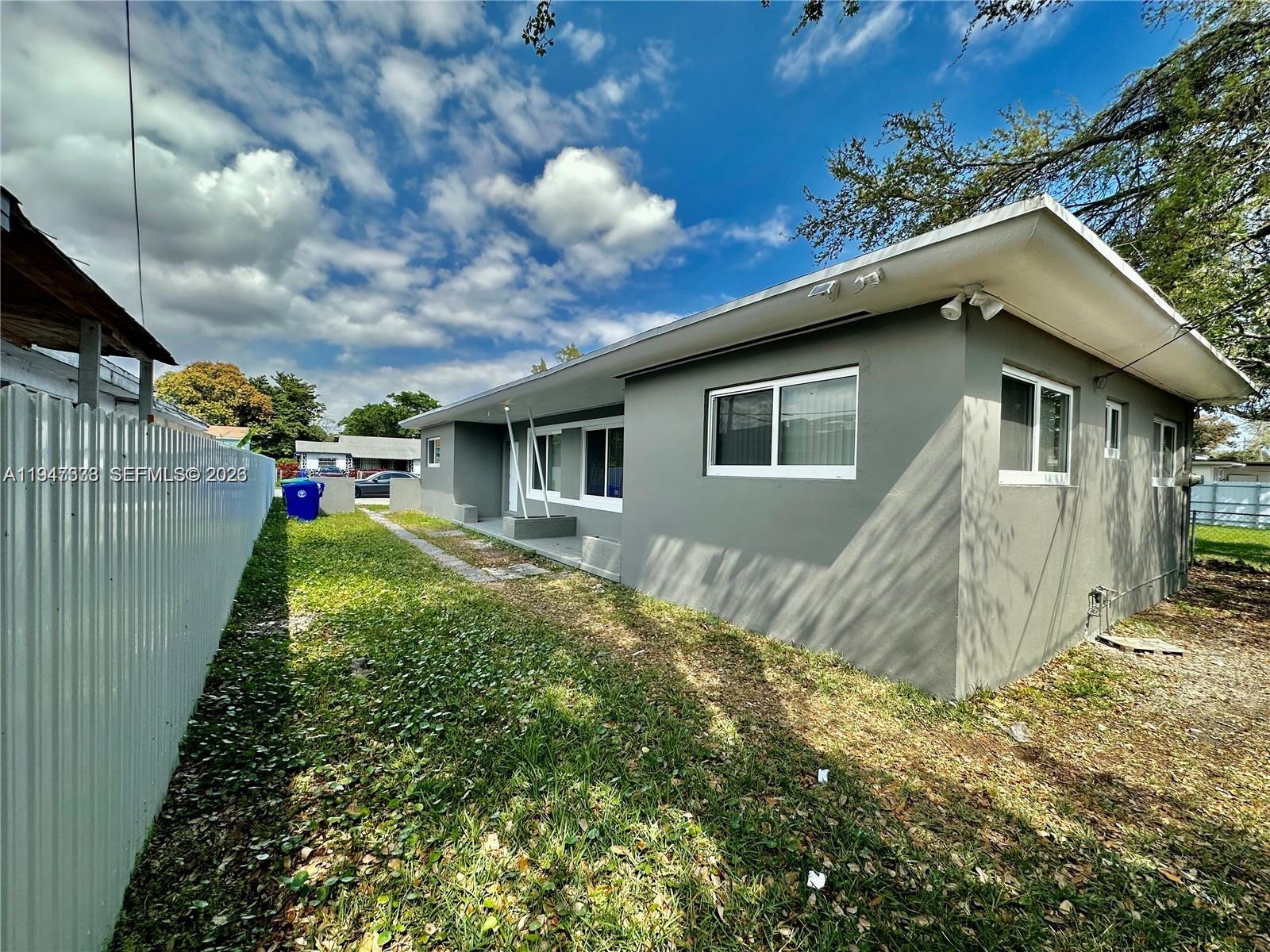 1894 Northwest 53rd Street Miami, FL 33142 - Photo 2 of 19 a view of backyard of house