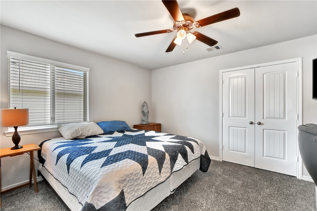 909 Davy Street Brenham, TX 77833 - Photo 22 of 35 Bedroom with carpet and ceiling fan