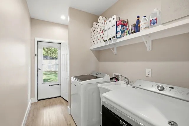 a view of a backyard with a table and chairs