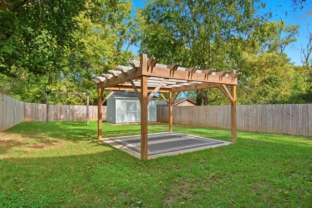 a view of backyard with green space