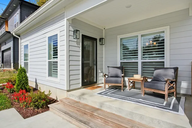 a view of a patio with a chairs and table in a patio