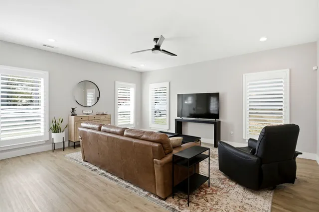 a living room with furniture or window and a flat screen tv