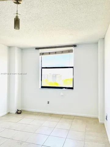 a view of a storage & utility room with a window