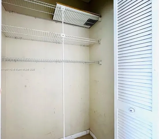 a view of a store room with wooden floor