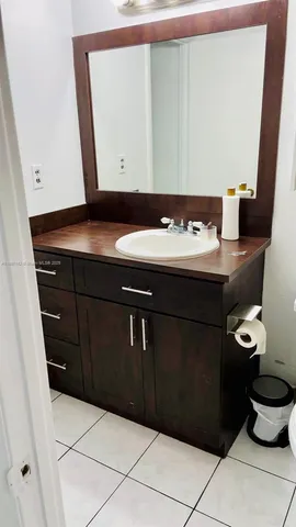 a room with a sink and a stove