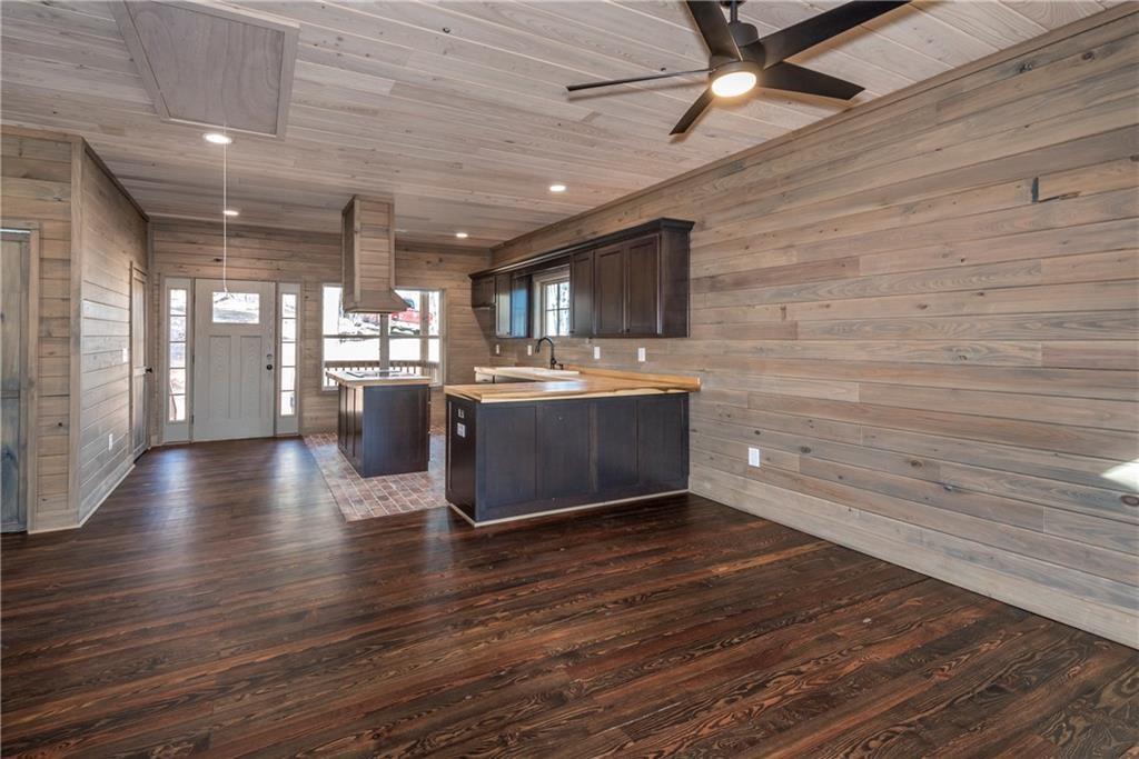 1041 Astro Court Northeast Ranger, GA 30734 - Photo 16 of 52 a living room with stainless steel appliances wooden floors