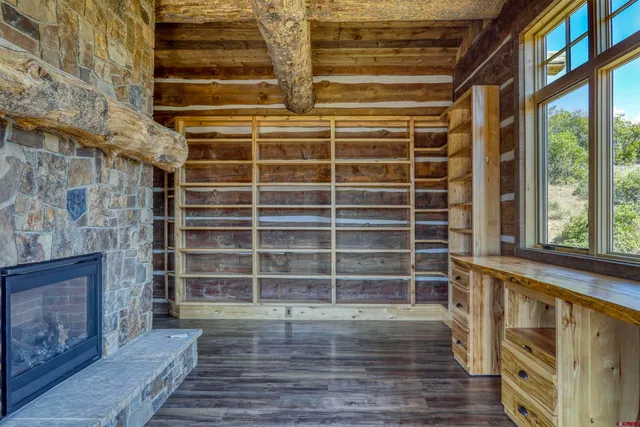 a living room with furniture and a book shelf