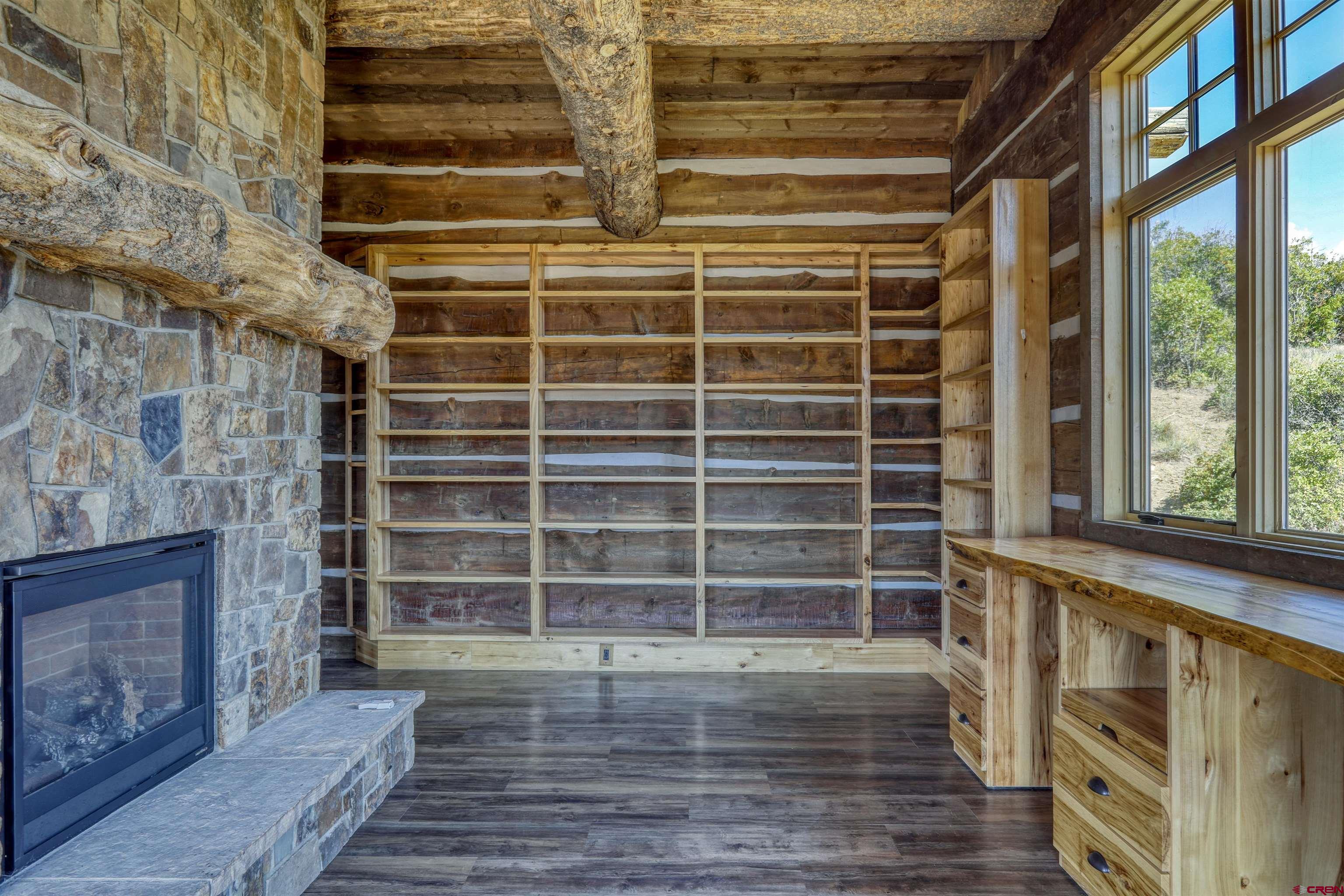 521 Spring Creek Circle Chromo, CO 81128 - Photo 13 of 35 a view of front door with wooden floor and windows