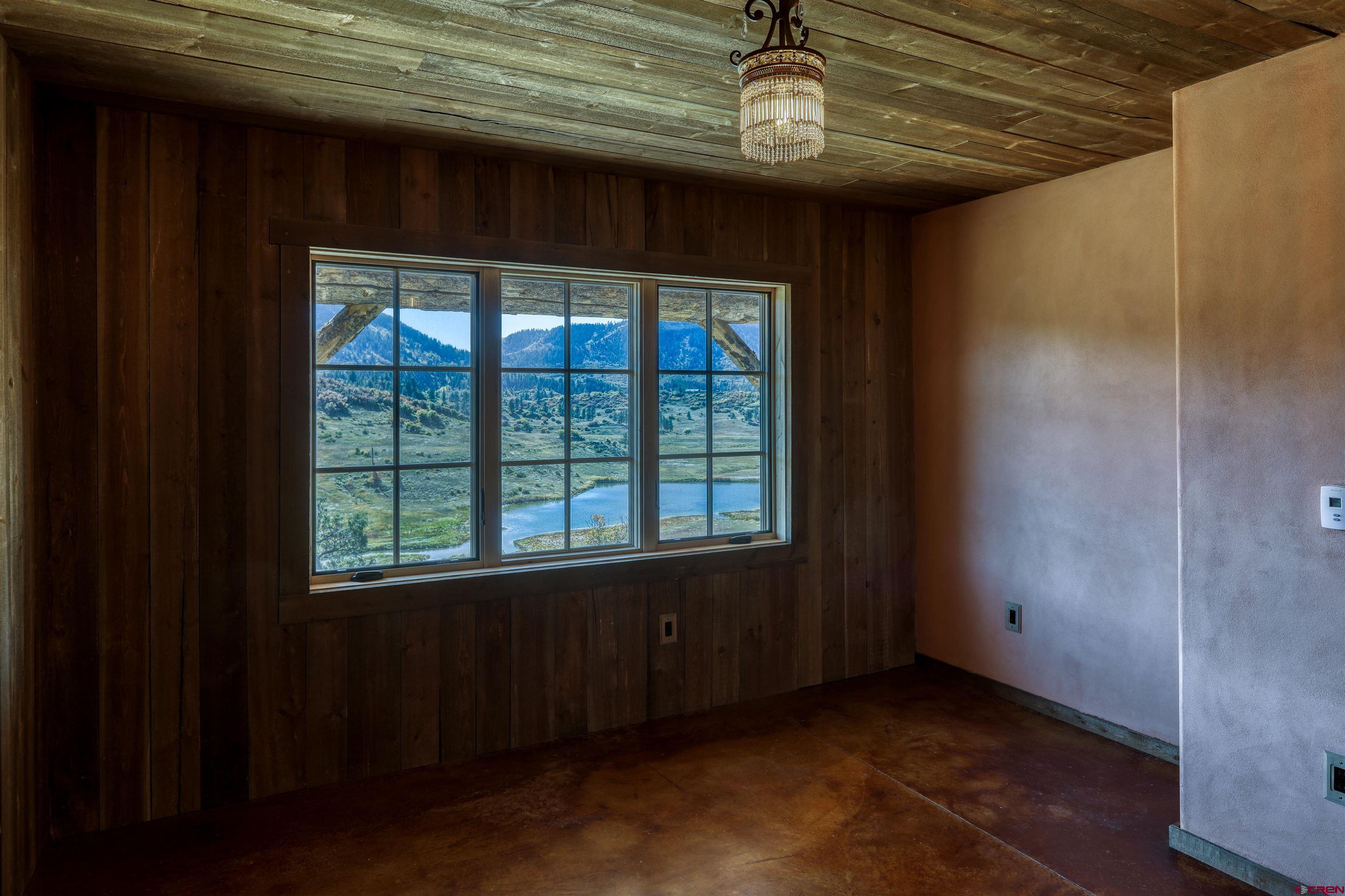 521 Spring Creek Circle Chromo, CO 81128 - Photo 16 of 35 a view of an empty room with a window
