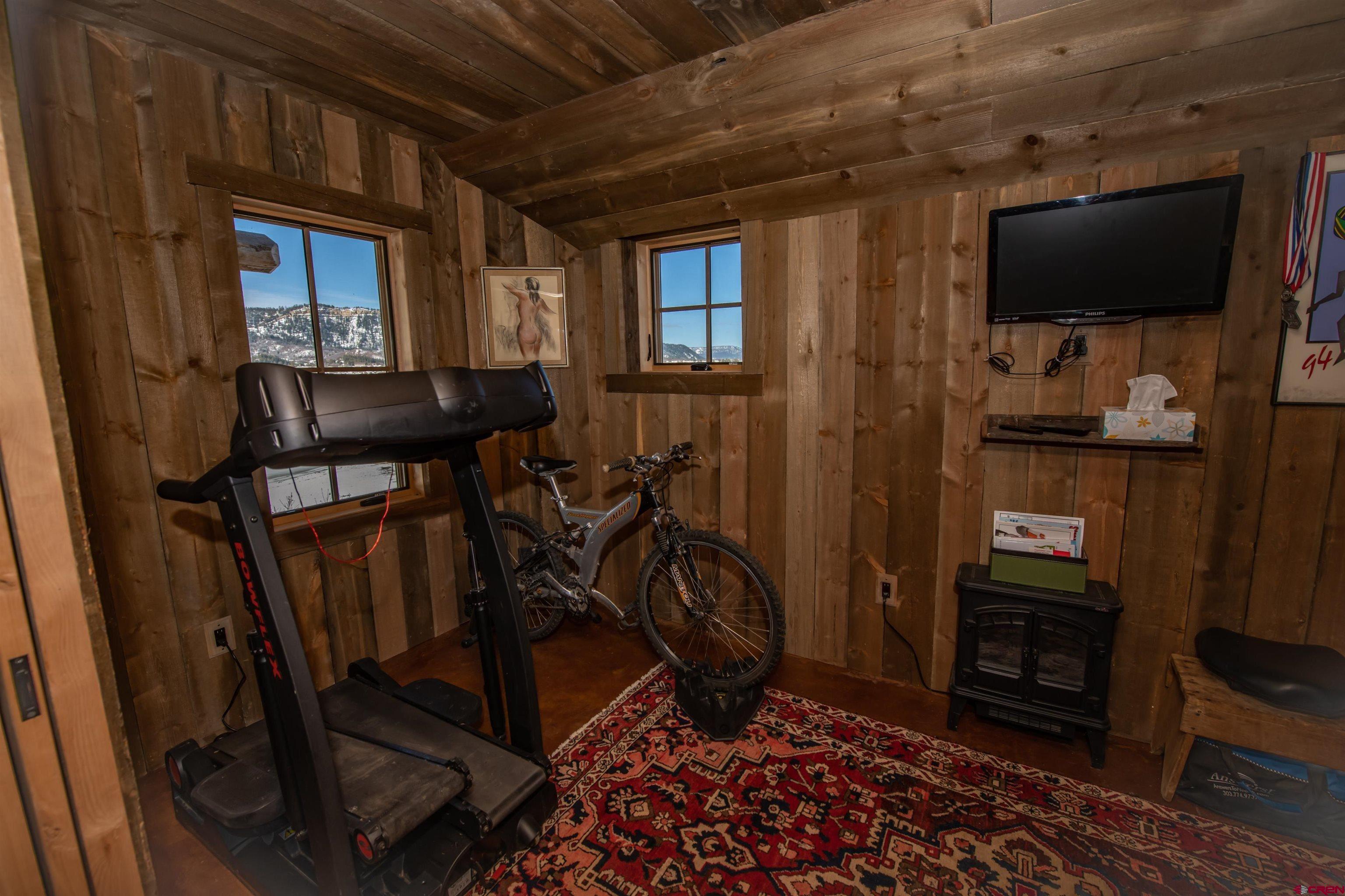 521 Spring Creek Circle Chromo, CO 81128 - Photo 19 of 35 a view of a livingroom with furniture and a flat screen tv