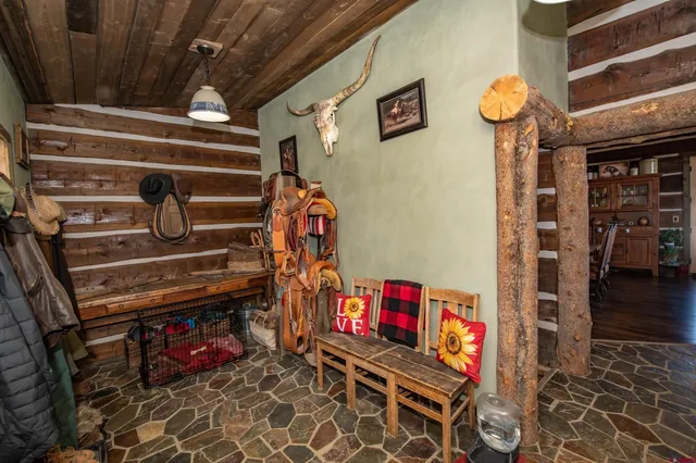 a view of outdoor space with wooden floor and windows