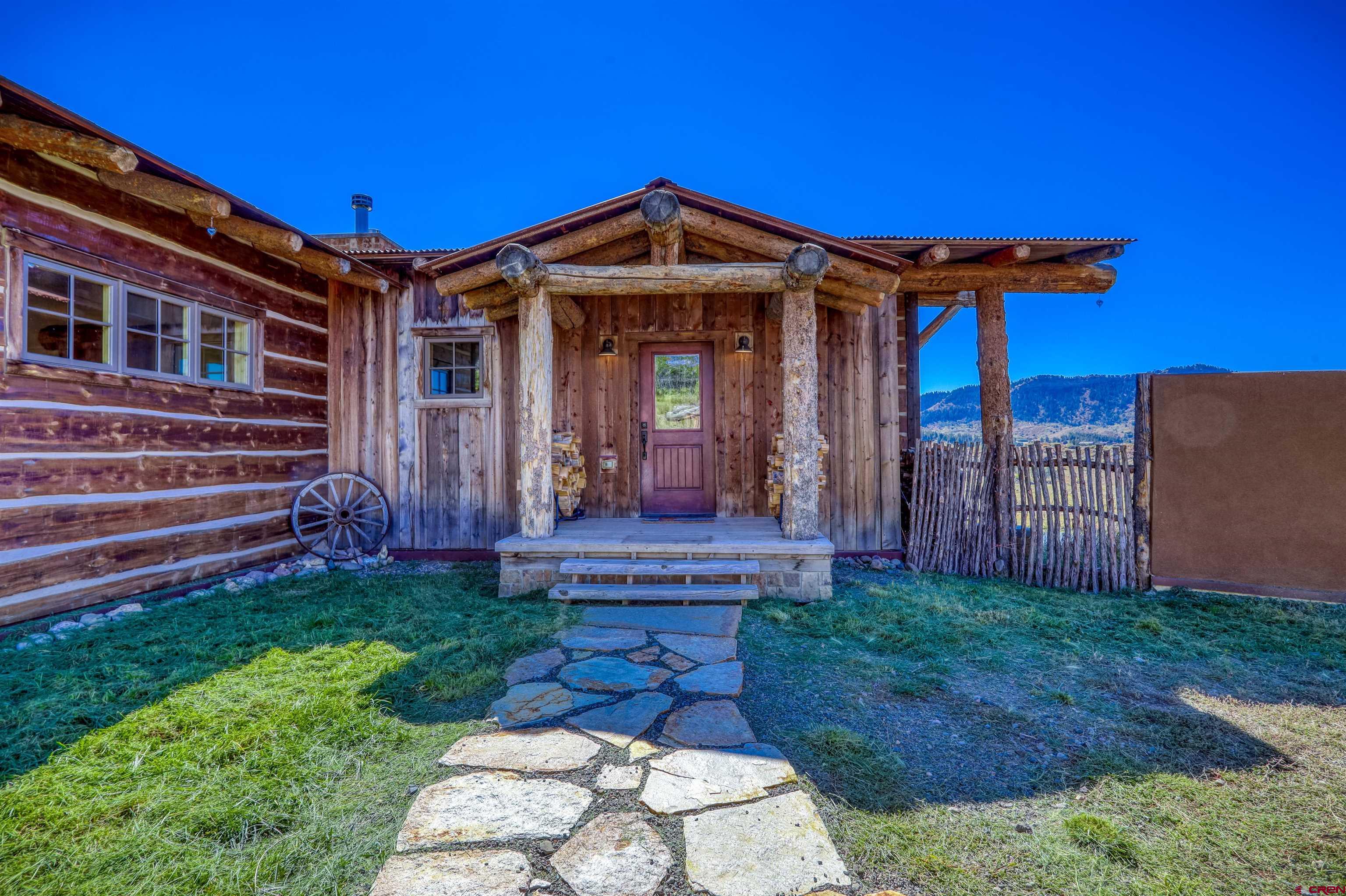 521 Spring Creek Circle Chromo, CO 81128 - Photo 26 of 35 a front view of a house with garden