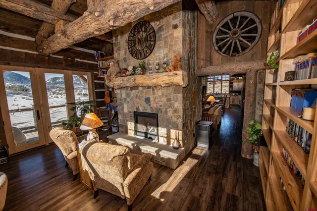 a living room with furniture a fireplace and blue walls