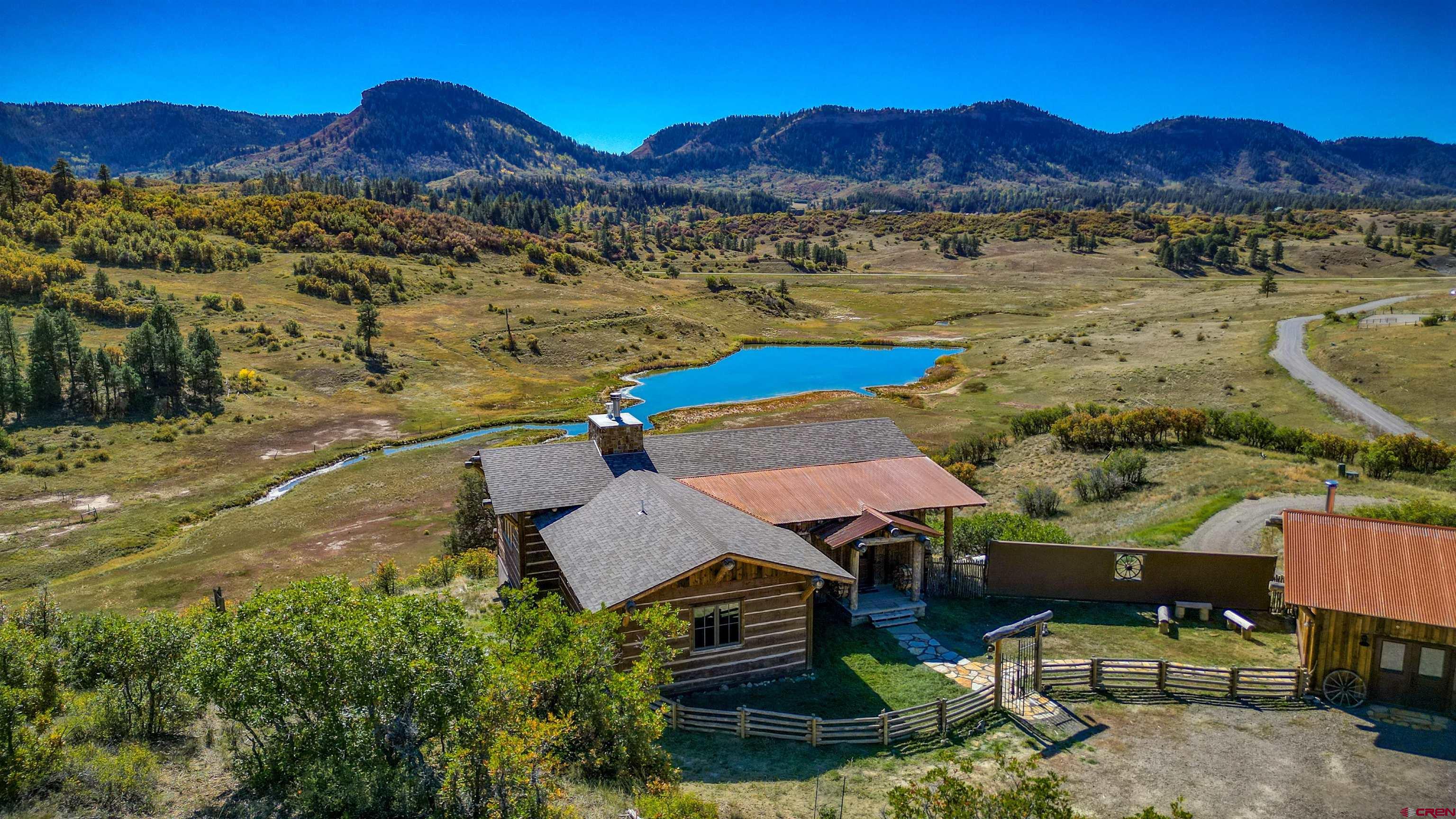 521 Spring Creek Circle Chromo, CO 81128 - Photo 32 of 35 a view of a lake with a mountain in the background