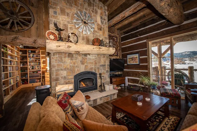 a room with a fireplace and a wooden door