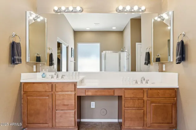 a bathroom with a sink vanity and a mirror